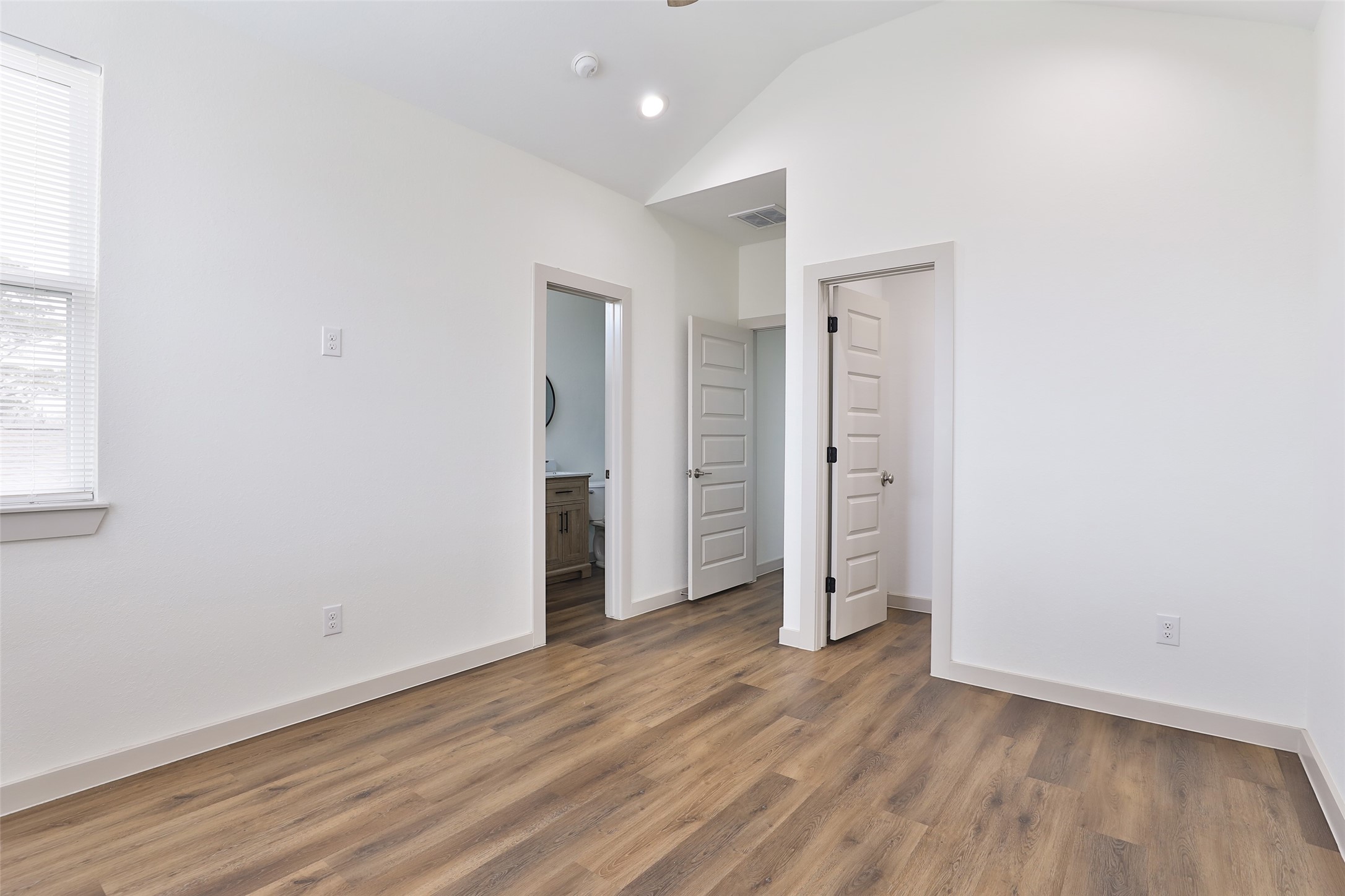7924 Booker Street, Unit B Houston, TX 77028 - Photo 17 of 19 an empty room with wooden floor and window