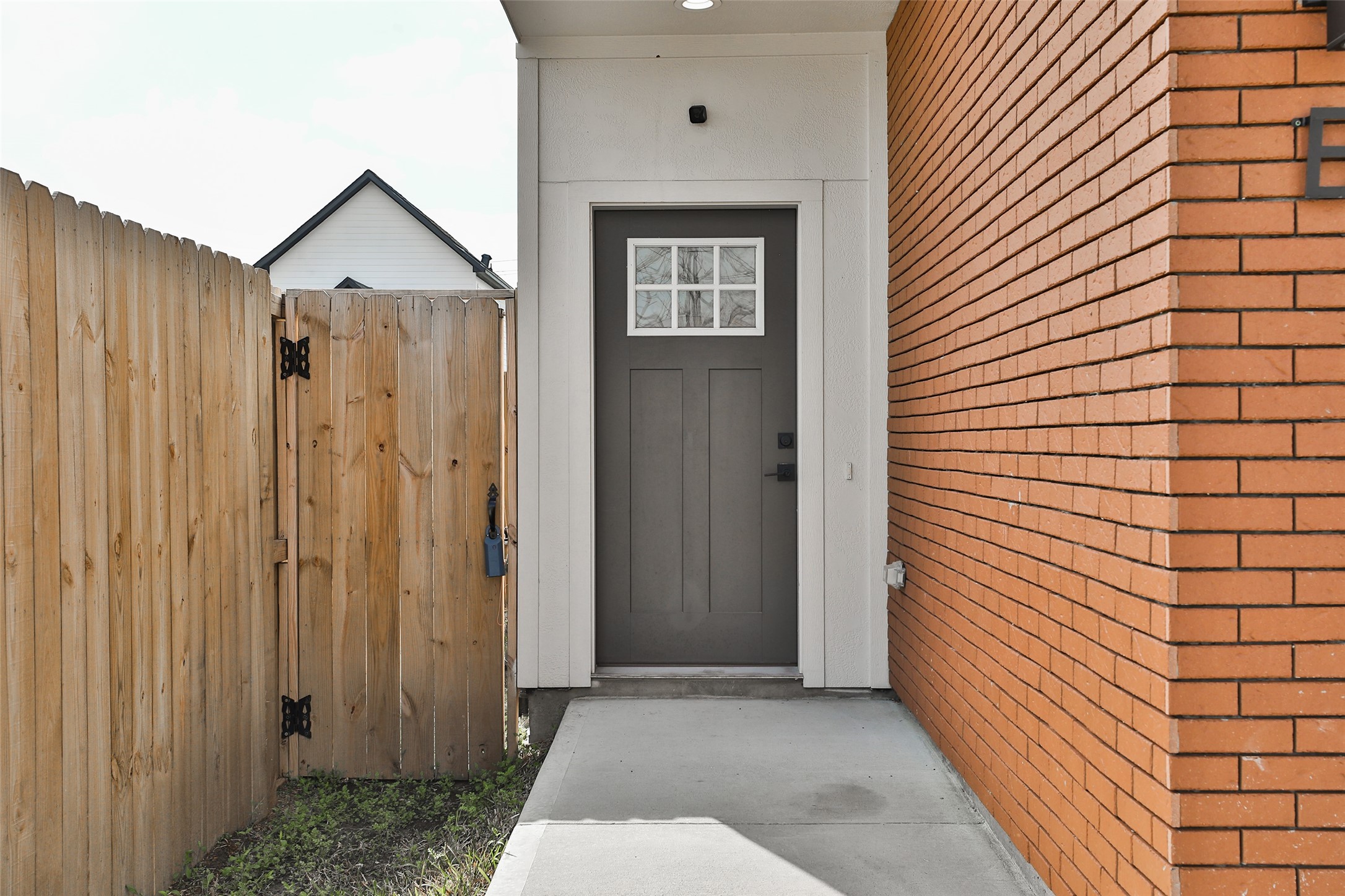 7924 Booker Street, Unit B Houston, TX 77028 - Photo 3 of 19 a view of a house with a door and wooden walls