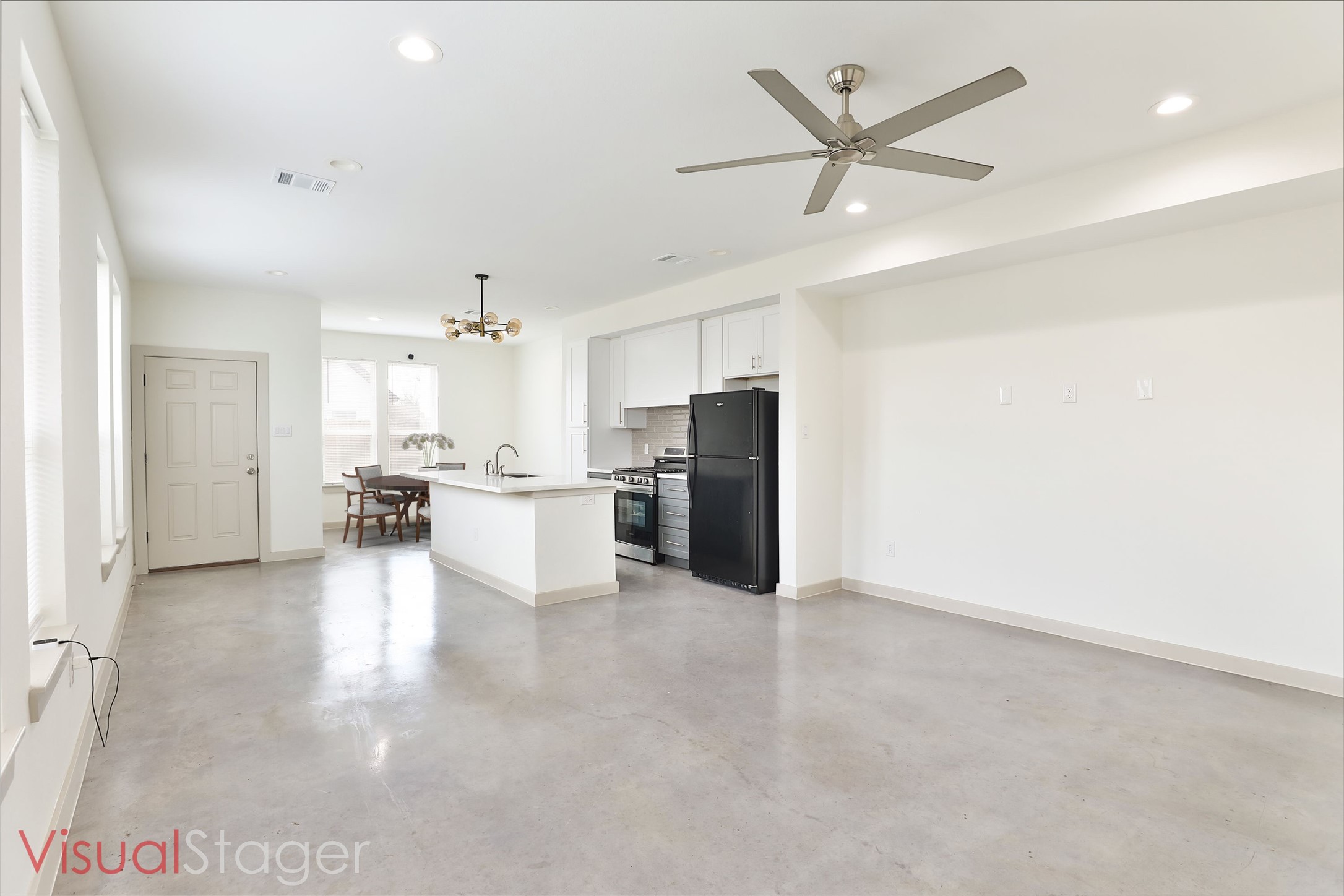 7924 Booker Street, Unit B Houston, TX 77028 - Photo 4 of 19 a view of a kitchen with a sink and a refrigerator