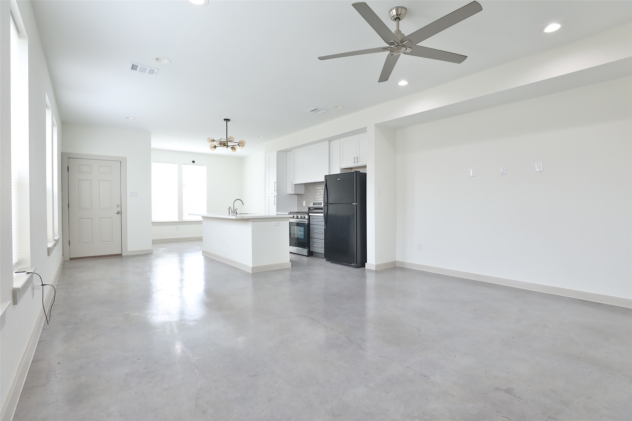 7924 Booker Street, Unit B Houston, TX 77028 - Photo 5 of 19 a view of a kitchen with a sink and refrigerator