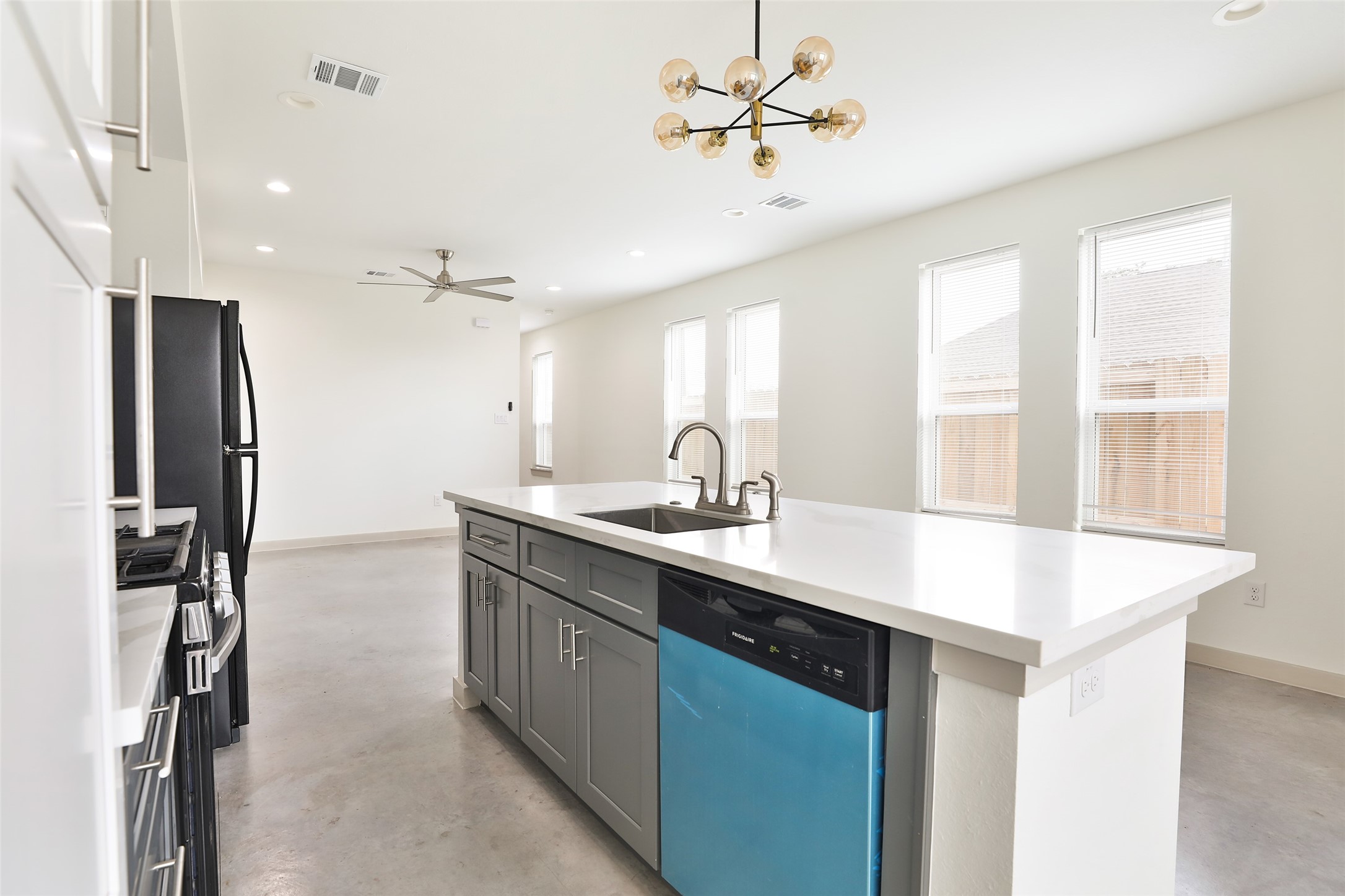 7924 Booker Street, Unit B Houston, TX 77028 - Photo 7 of 19 a kitchen with stainless steel appliances a sink and a refrigerator