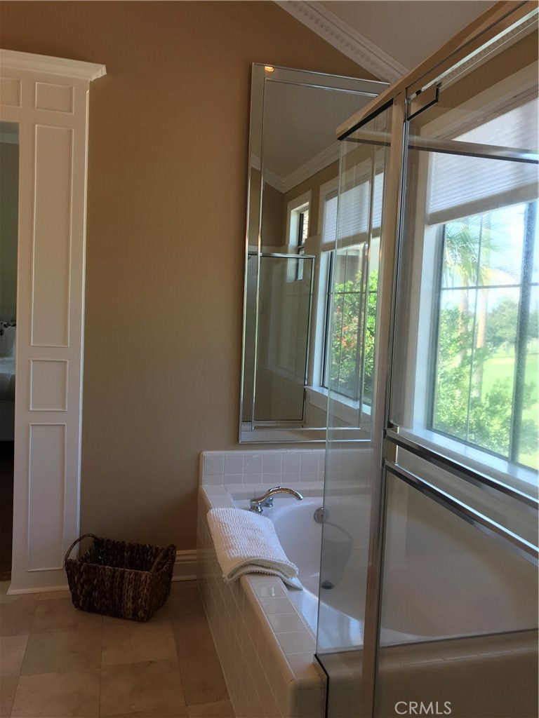 12823 Maxwell Drive Tustin, CA 92782 - Photo 12 of 25 a room with a chair and a window