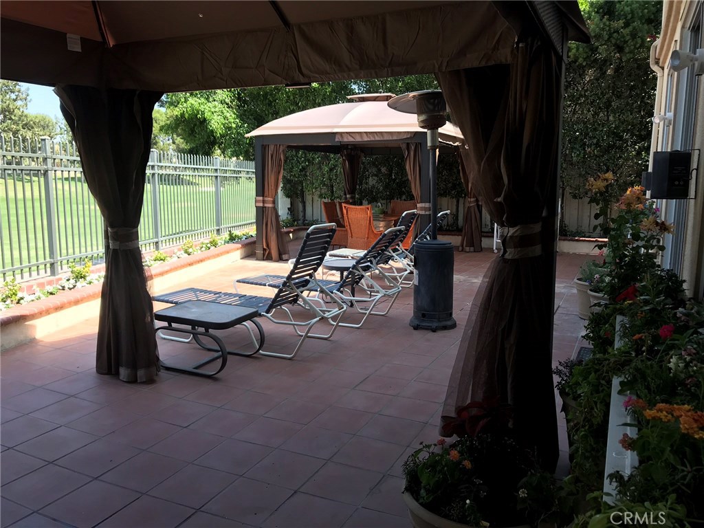 12823 Maxwell Drive Tustin, CA 92782 - Photo 17 of 25 an outdoor space with patio furniture and garden