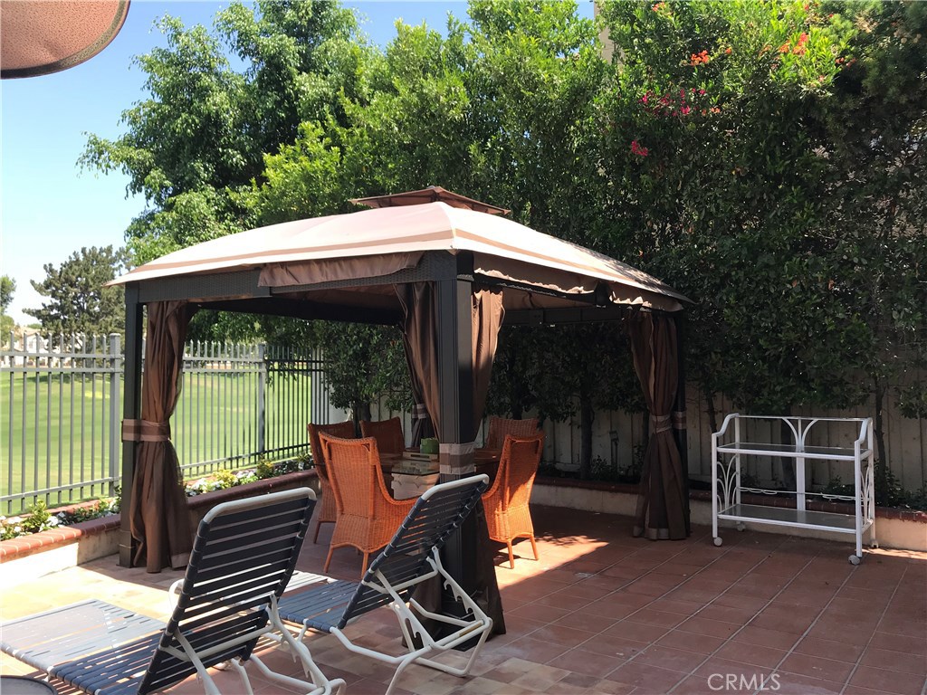 12823 Maxwell Drive Tustin, CA 92782 - Photo 20 of 25 a backyard of a house with seating space