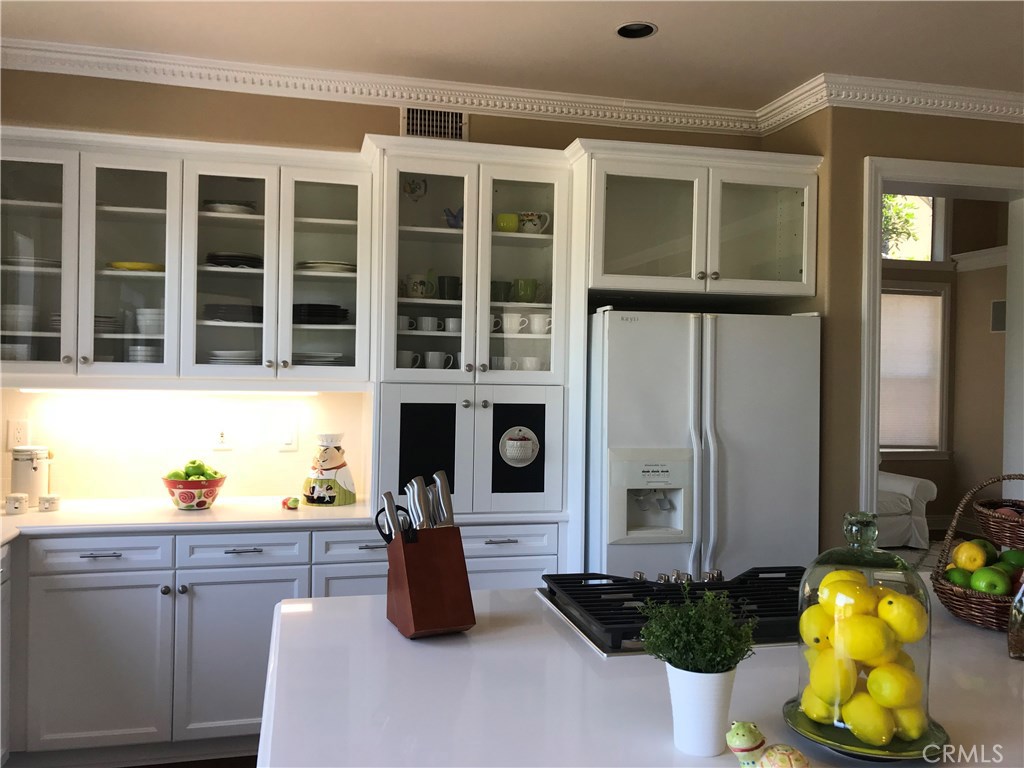 12823 Maxwell Drive Tustin, CA 92782 - Photo 21 of 25 a front view of a house with a garden