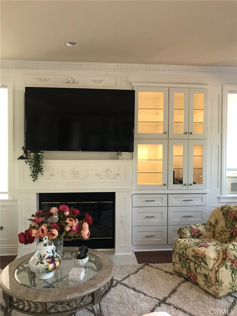 12823 Maxwell Drive Tustin, CA 92782 - Photo 23 of 25 a living room with furniture and a fireplace