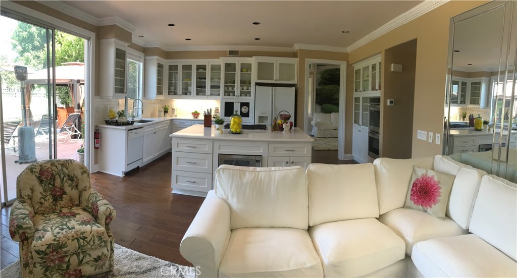 12823 Maxwell Drive Tustin, CA 92782 - Photo 24 of 25 a living room with furniture and large windows