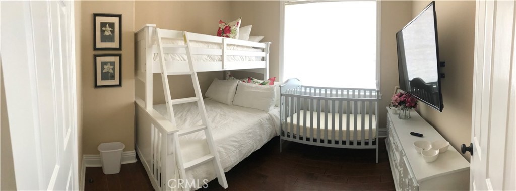 12823 Maxwell Drive Tustin, CA 92782 - Photo 4 of 25 a bedroom with a bed and a window