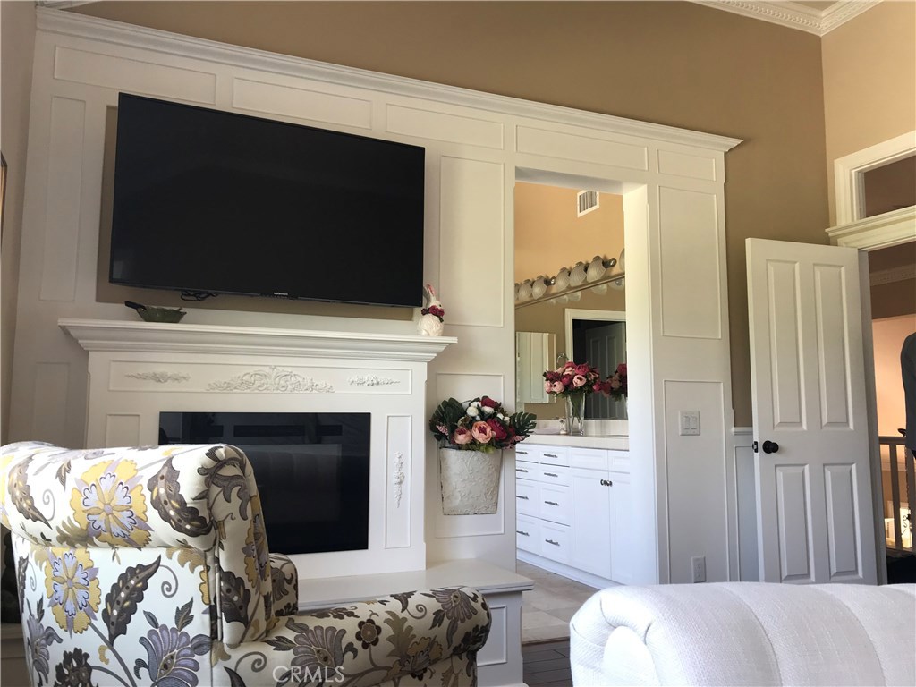 12823 Maxwell Drive Tustin, CA 92782 - Photo 6 of 25 a living room with furniture and a fireplace