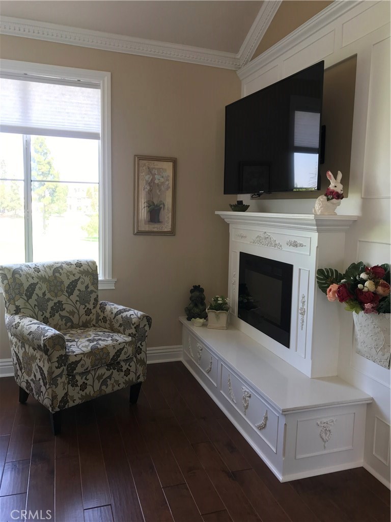 12823 Maxwell Drive Tustin, CA 92782 - Photo 8 of 25 a living room with furniture and a flat screen tv