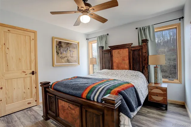 a bed room with a bed and a window