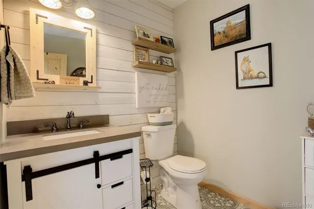 a view of a kitchen with sink dishwasher and wooden floor