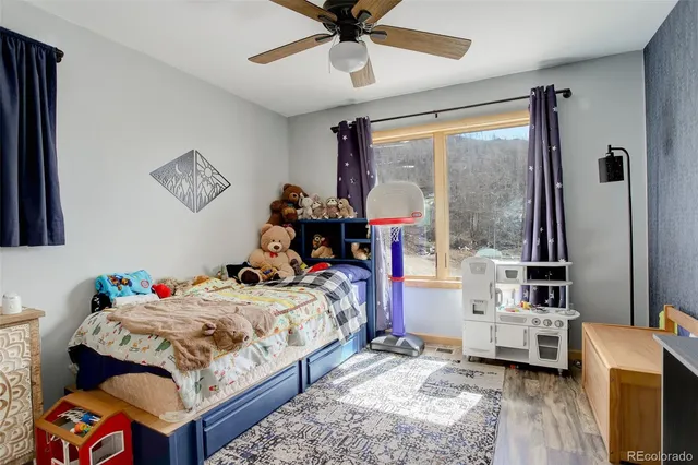 an aerial view of a house with a yard and lake view