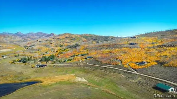 a large kitchen with lots of counter space dining table and stainless steel appliances