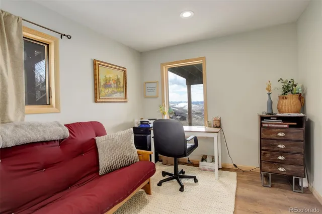 a view of an entryway with wooden floor