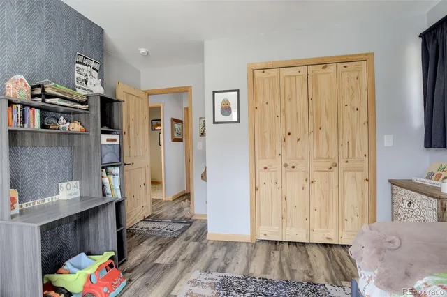 a bed room with a bed and a window