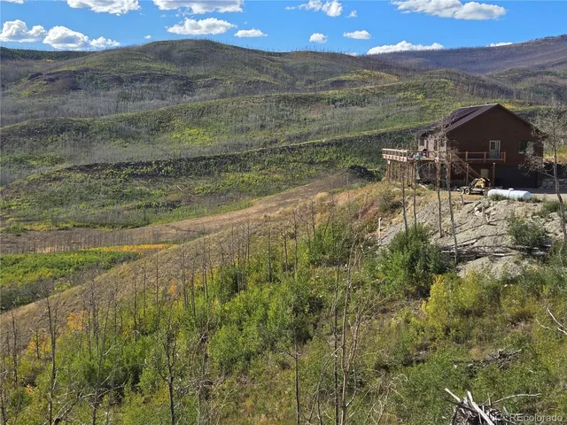 a view of a balcony with table and chairs