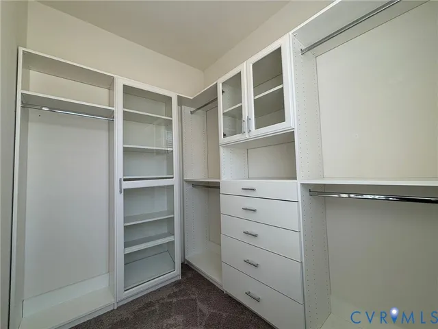 a view of an empty walk in closet