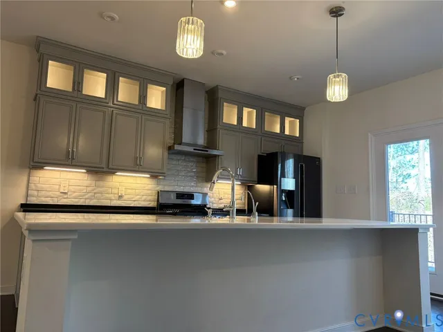 a view of a kitchen with a sink and a window