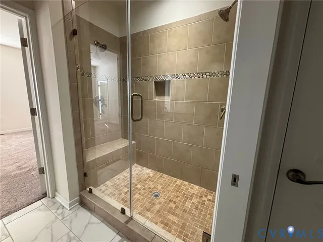 a bathroom with a shower and a sink