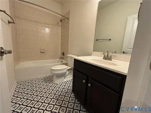 a bathroom with a sink a toilet a shower and a mirror