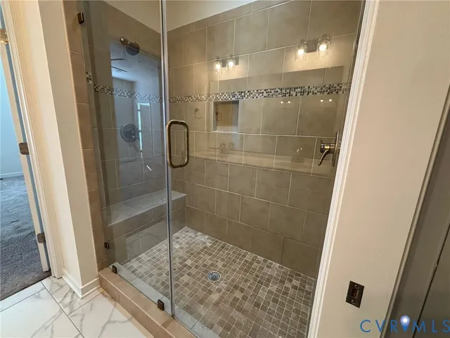a bathroom with a shower and a sink