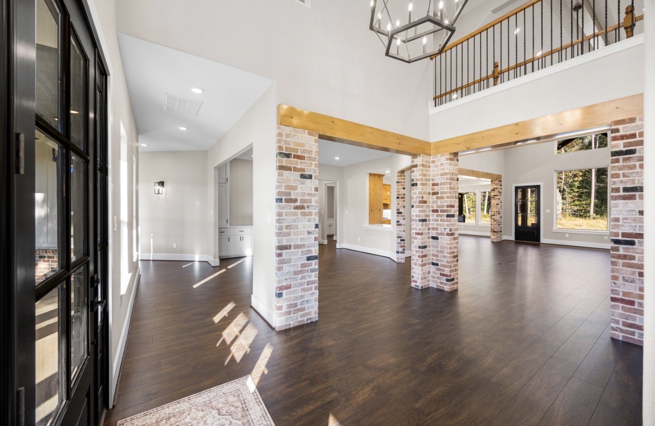 41 Pausel Road Huntsville, TX 77340 - Photo 14 of 41 a hallway with wooden floor and dining room