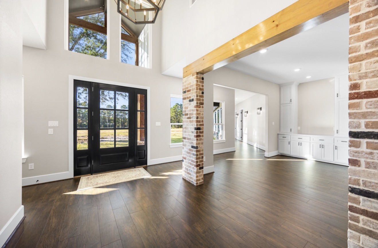 41 Pausel Road Huntsville, TX 77340 - Photo 15 of 41 a view of an entryway with wooden floor and windows