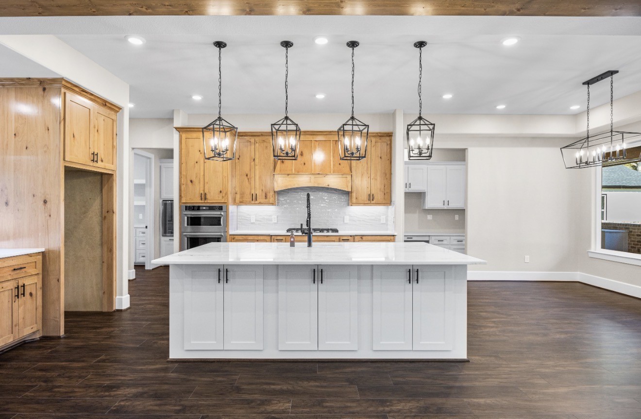 41 Pausel Road Huntsville, TX 77340 - Photo 22 of 41 a kitchen with kitchen island a sink stainless steel appliances and cabinets