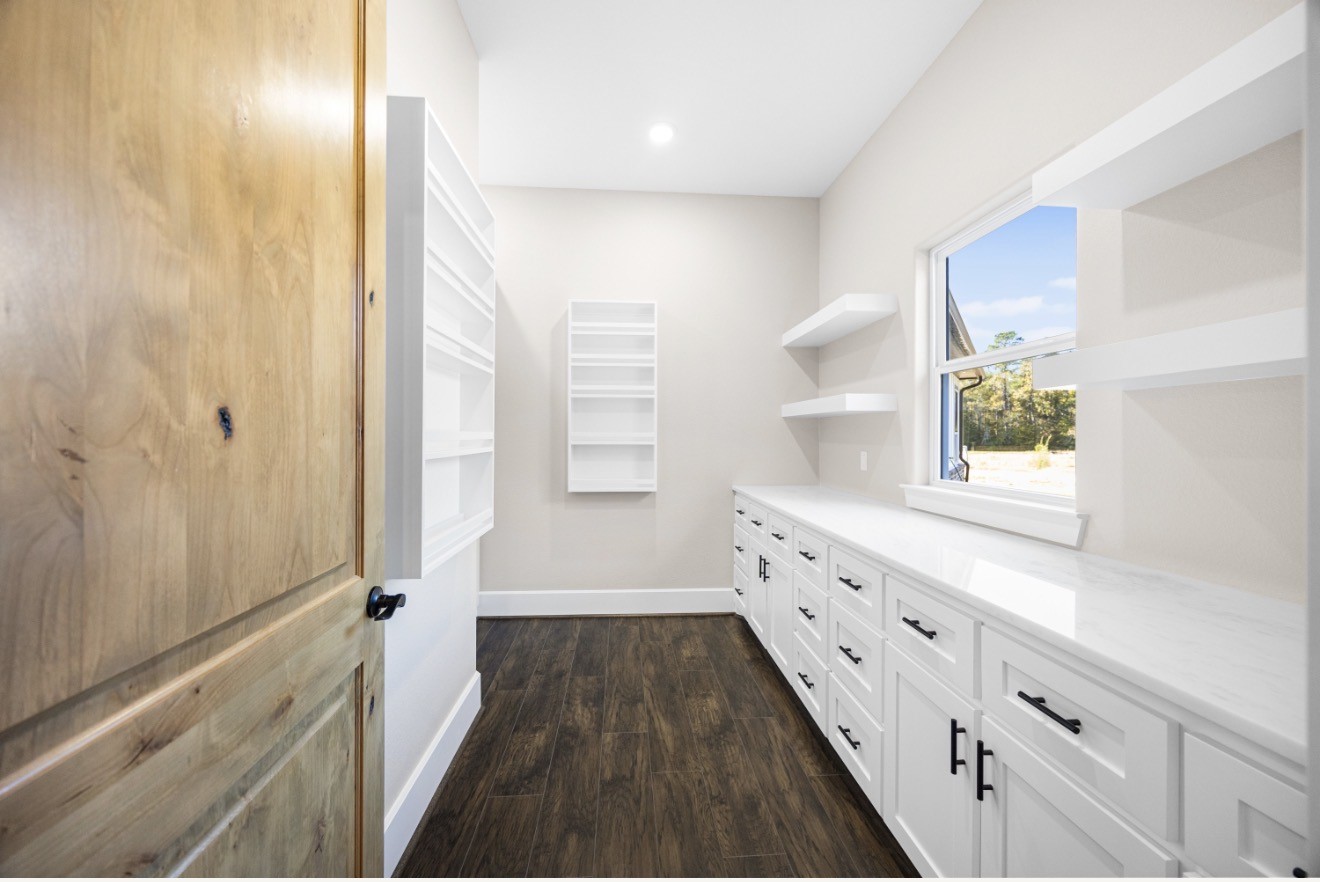 41 Pausel Road Huntsville, TX 77340 - Photo 27 of 41 a bathroom with a double vanity sink and a mirror