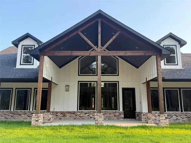 a view of a house with swimming pool and porch
