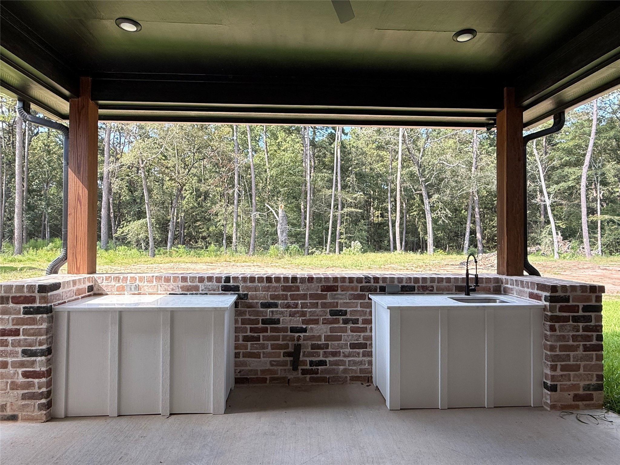 41 Pausel Road Huntsville, TX 77340 - Photo 10 of 41 a room with kitchen island a large window
