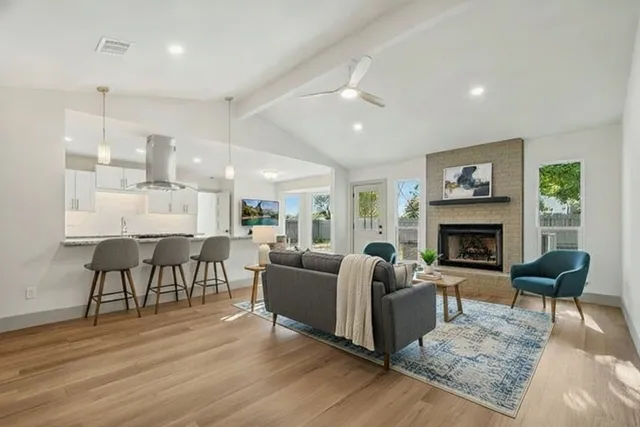 a living room with furniture and a fireplace
