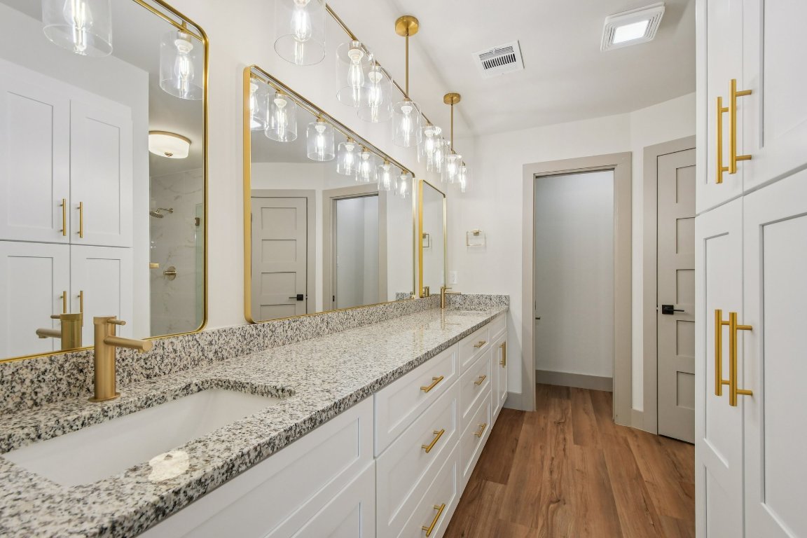417 Oakridge Pass Cedar Park, TX 78613 - Photo 21 of 33 a bathroom with a granite countertop sink mirror and vanity