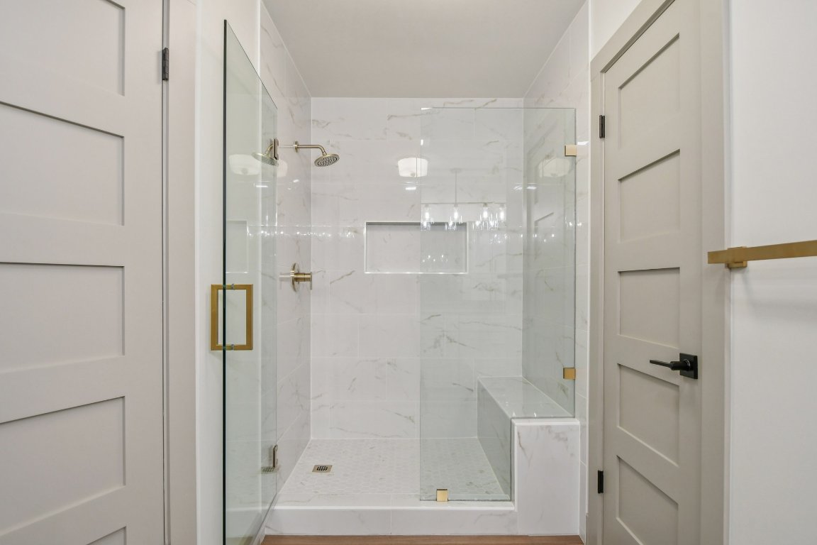 417 Oakridge Pass Cedar Park, TX 78613 - Photo 22 of 33 a bathroom with a glass shower door