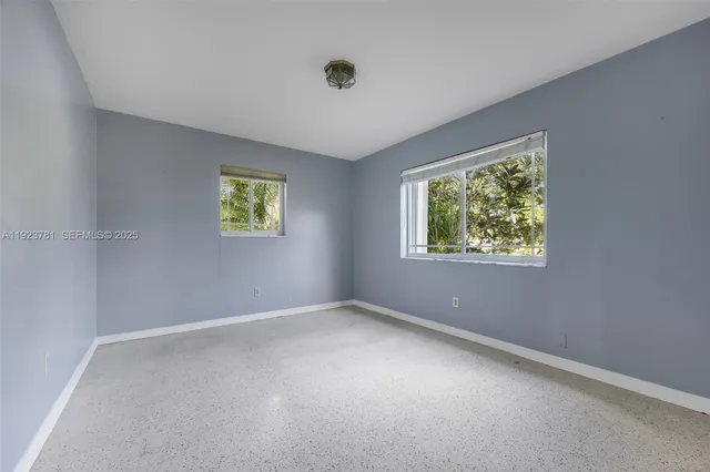 an empty room with windows