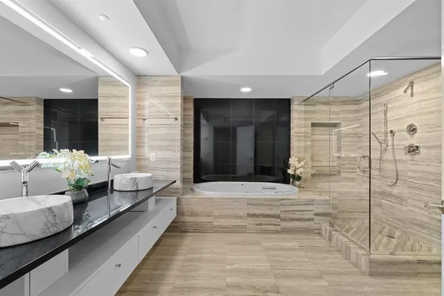 a lobby with furniture and large windows