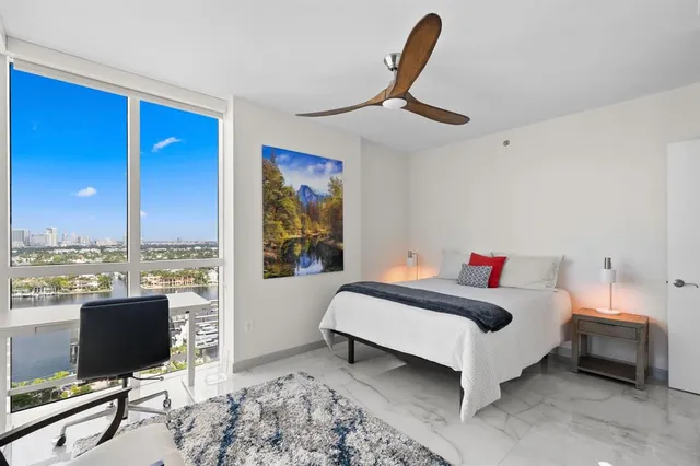a bedroom with furniture and a window