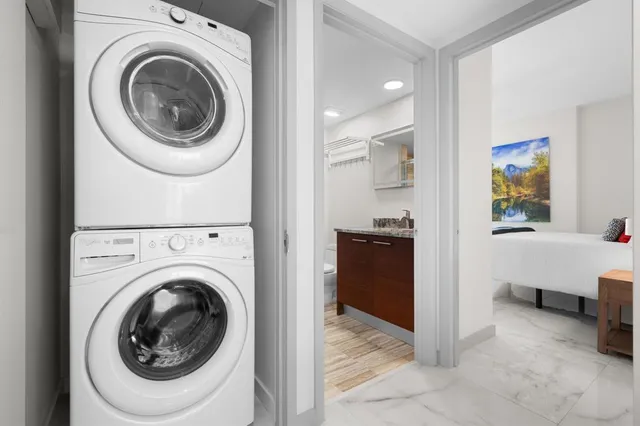 a view of a hallway with washer and dryer