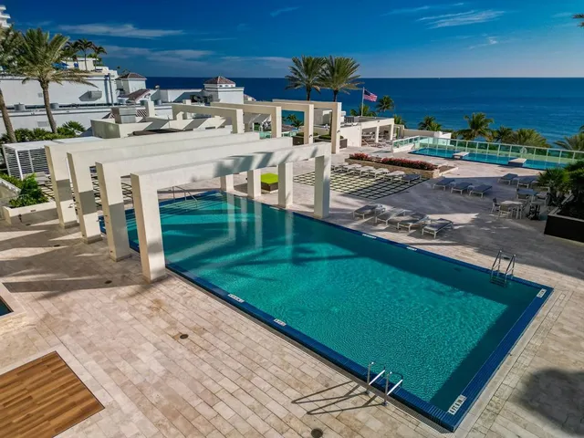 a view of a backyard with sitting area