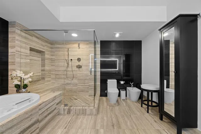 a bathroom with a sink a mirror and a shower