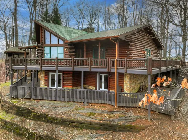 a view of a lush green hillside and a mountain