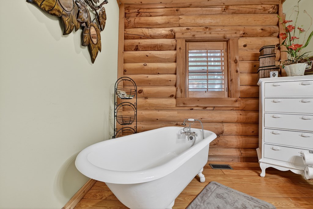 260 Observation Lane Blue Ridge, GA 30513 - Photo 42 of 100 a bathroom with a bathtub and shower