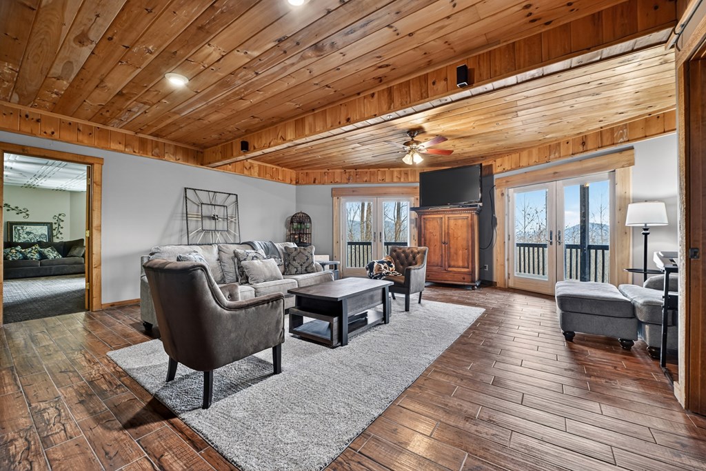 260 Observation Lane Blue Ridge, GA 30513 - Photo 48 of 100 a living room with furniture and wooden floor