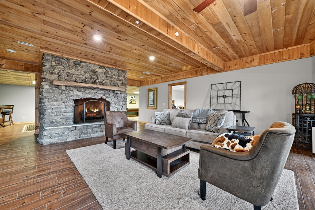 260 Observation Lane Blue Ridge, GA 30513 - Photo 49 of 100 a living room with furniture and a fireplace