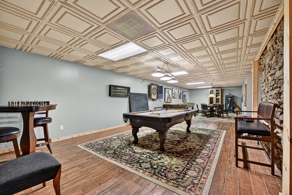 260 Observation Lane Blue Ridge, GA 30513 - Photo 50 of 100 a view of a livingroom with furniture and a wooden floor