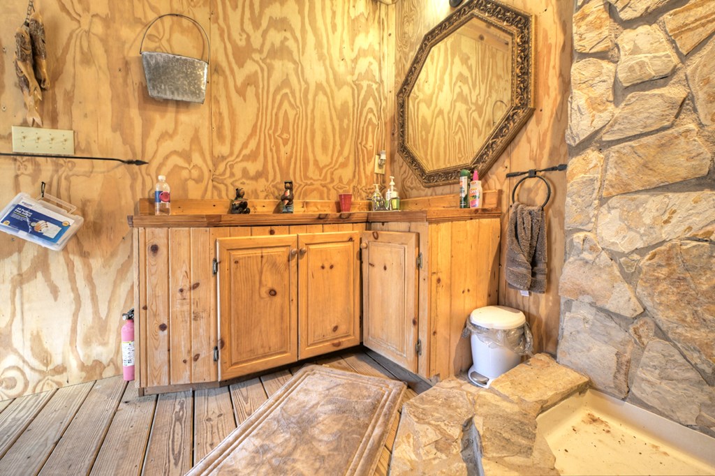 260 Observation Lane Blue Ridge, GA 30513 - Photo 71 of 100 a view of a bathroom with a sink and wooden floor