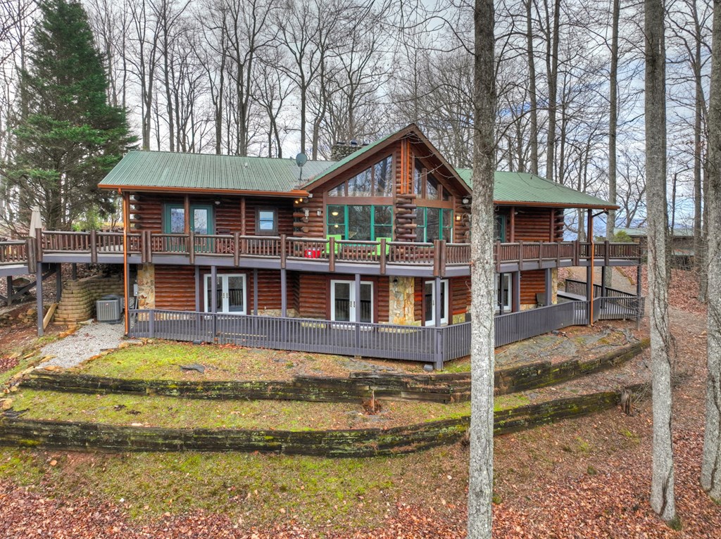 260 Observation Lane Blue Ridge, GA 30513 - Photo 97 of 100 a front view of a house with a yard table and chairs