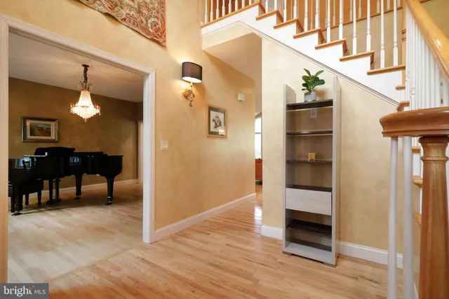 a kitchen with stainless steel appliances granite countertop a refrigerator a sink and a stove