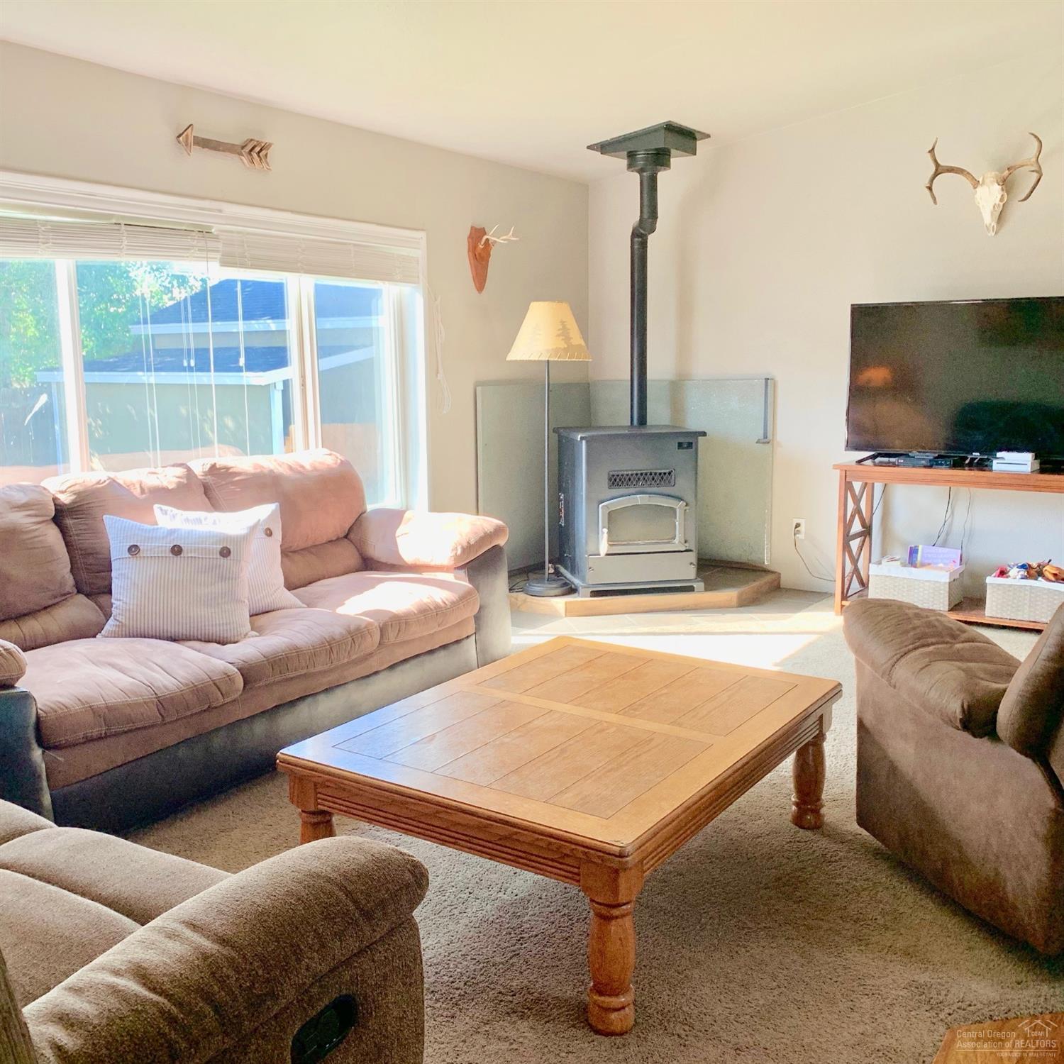703 Center Ridge Drive Culver, OR 97734 - Photo 14 of 22 Living room with pellet stove